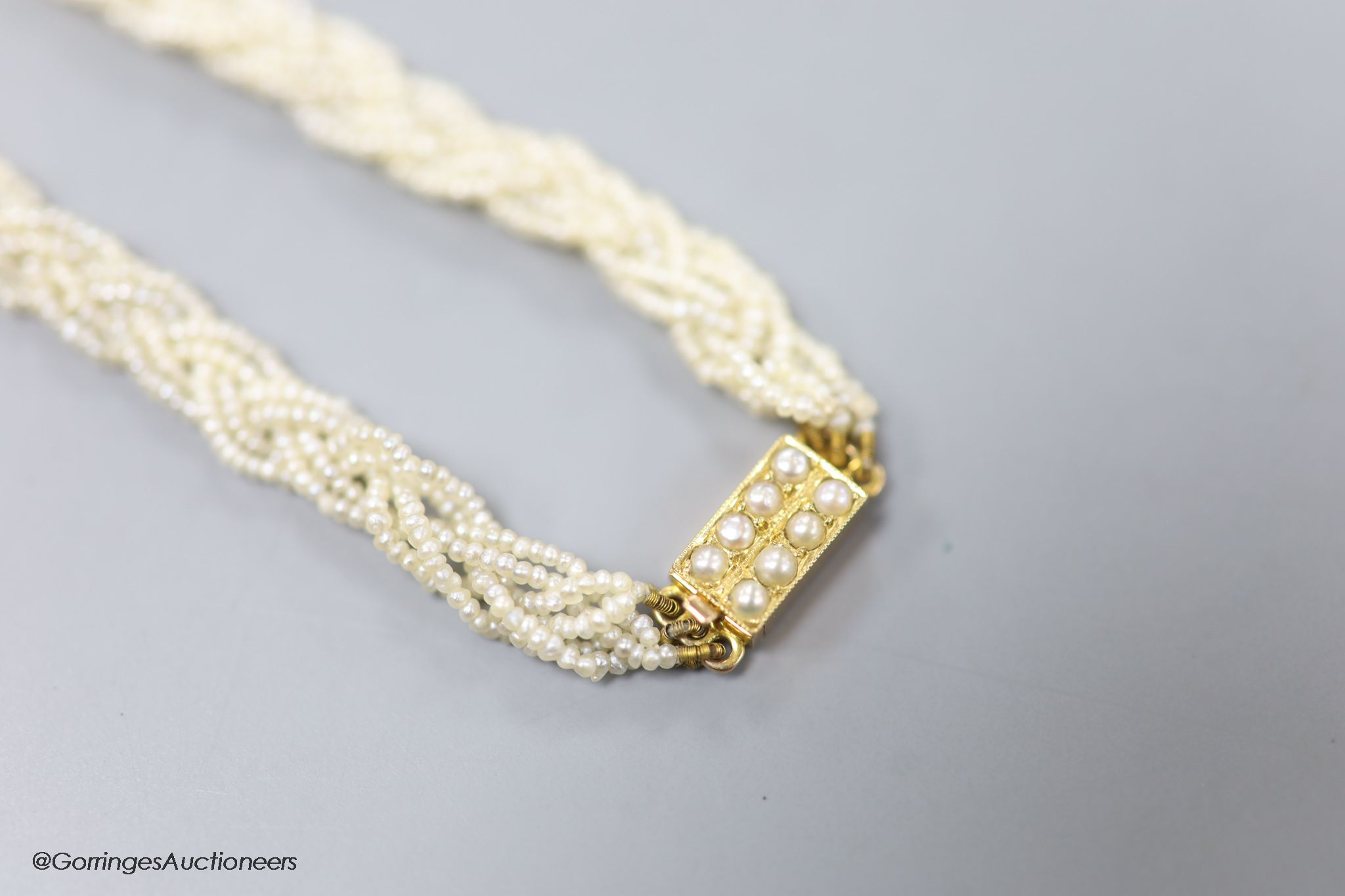 A 19th century 15ct and interwoven seed pearl choker necklace, 38cm.